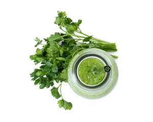 Healthy parsley smoothie in bottle, drinking straw and leaves isolated on white, top view