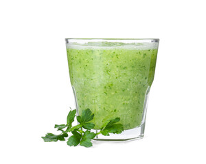 Healthy parsley smoothie in glass and leaves isolated on white