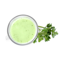 Healthy parsley drink in glass and leaves isolated on white, top view