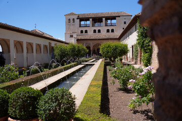 Title (184 characters): Stunning architecture and serene gardens of the historic Alhambra palace in Granada, Spain - Explore the magnificence of Moorish design in this UNESCO World Heritage Site