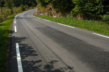 winding country road in forested area.