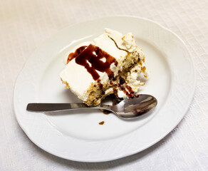 Coffee dessert tiramisu served with cream on plate