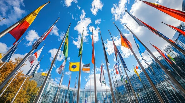 International flags displayed against blue sky at united nations headquarters