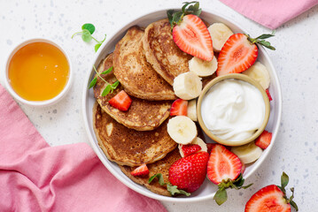 Buckwheat pancakes with berries, honey and yogurt