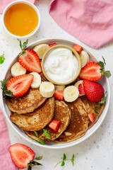 Buckwheat pancakes with berries, honey and yogurt