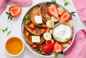Buckwheat pancakes with berries, honey and yogurt