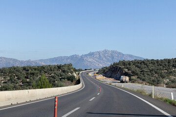 A stunning photograph of a scenic road winding through the breathtaking landscapes of Turkey. 