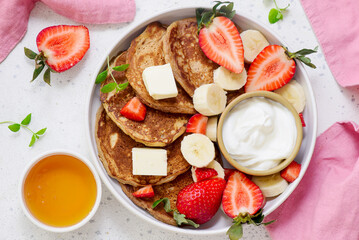 Buckwheat pancakes with berries, honey and yogurt