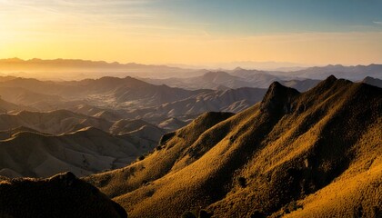 Obraz premium Mountain ranges and hills of forests and lakes during golden hour and a bright sky