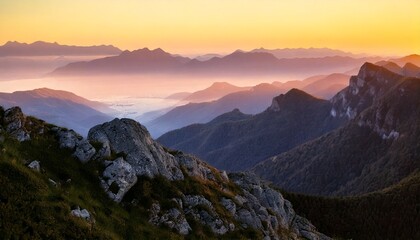 Mountain ranges and hills of forests and lakes during golden hour and a bright sky