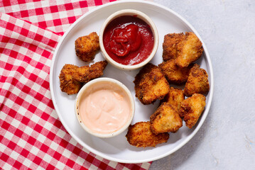 Chicken nuggets with french fries and ketchup .selective focus