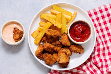 Chicken nuggets with french fries and ketchup .selective focus