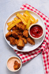 Chicken nuggets with french fries and ketchup .selective focus