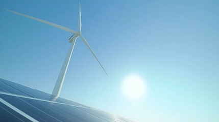 Fototapeta premium A wind turbine stands against a clear blue sky, capturing sunlight and wind energy, symbolizing renewable energy and sustainability.