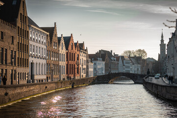 Bruges Canals Reflecting Historic Architecture at Sunset