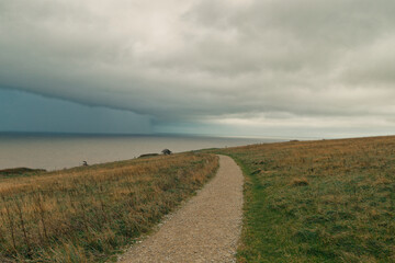 View of heavy clouds from a cliff
