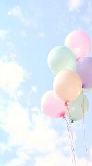Pastel balloons floating in a soft sky