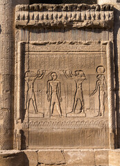 Bas-relief carvings of gods and kings on the well-preserved facade of the Temple of Esna with...