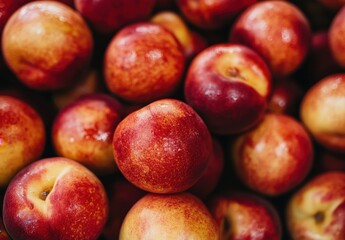 Fresh and Juicy Nectarines Piled Together in a Colorful Display Capturing the Essence of Summer Fruits and Healthy Eating Choices for Delicious Treats