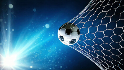 A soccer ball enters the net, creating dramatic action shot