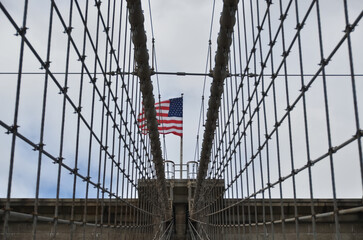 Obraz premium Suspension Bridge with American Flag