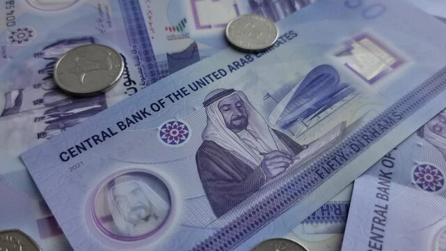 4K Close Up of new UAE 50 dirhams currency notes, paper money, against white background, released on Dec, 2021 to mark Golden jubilee. Finance and Economy concepts.