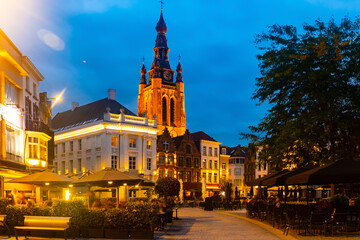 Evening central Grote Markt square with a view of the bell tower of St. Martin Church in Kortrijk, Belgium