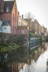 Bruges Canals Reflecting Historic Architecture at Sunset