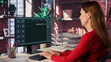 Woman typing prompts into an AI powered chat system on her computer, advanced virtual assistant...