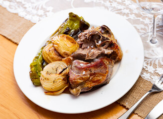 Delicious roasted lamb with potatoes and peppers served on platter