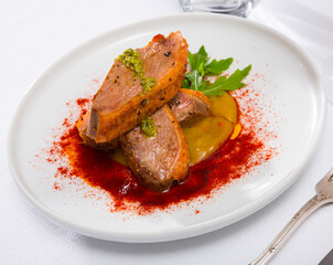Fried duck breast on spicy mango sauce served with smoked sweet pepper and arugula