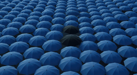 Obraz premium Person standing in crowd of blue umbrellas.