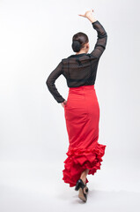 Spanish flamenco dancer in traditional dress isolated on white background for the April Fair 