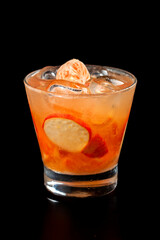 Refreshing fresh tangerine and cashew juice blend for a healthy drink option black blackground