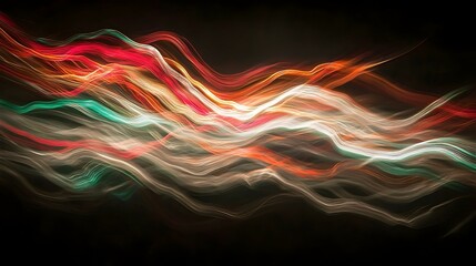 Obraz premium Abstract light painting artwork. Wavy colorful light streaks on a dark background. Perfect for design projects.