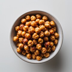 Obraz premium Roasted chickpeas on plain white background clean simple and minimalist focus top view
