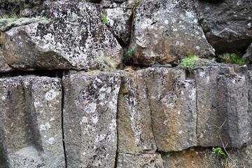 Rough basalt rock formations creating a natural wall in Iceland