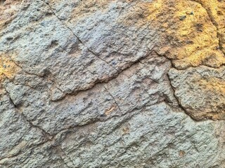 Close up of cracked rock surface in Iceland, showing geological texture and detail