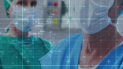 Healthcare professionals in surgical attire with digital data overlay animation - Powered by Adobe