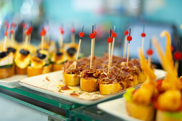 Pinchos jamon - traditional Spanish snack or bar snack with ham