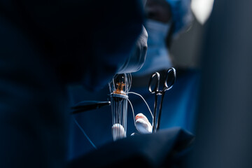 Selective focus of a doctor hand in surgical uniform and gloves. Male Surgeon Perform a Surgical...