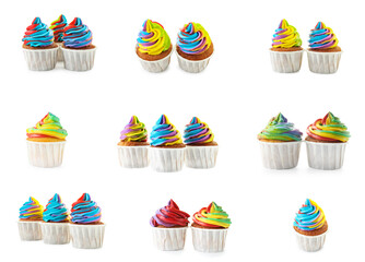 Yummy cupcakes with bright rainbow cream isolated on white, set