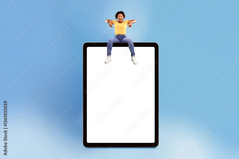 Aufkleber beautiful young african american woman sitting on top of huge digital tablet and pointing down at em