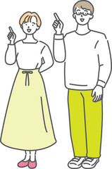 同じ方向に並んで指差しをする若い夫婦のイラスト素材