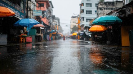 Colorful umbrellas adorn a nighttime market as rain creates a reflective scene full of atmosphere