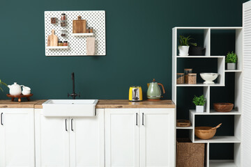 Stylish kitchen with pegboard and kitchenware