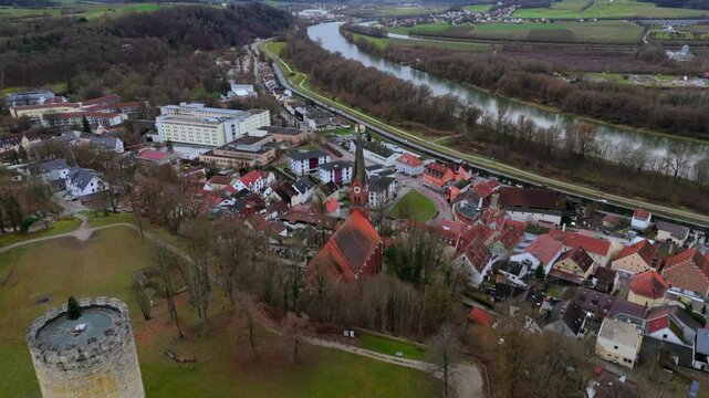 Roman Catholic parish church of St. Nicholas in Bad Abbach, market town in Lower Bavarian district of Kelheim, Germany aerial view in fall or winter. Kath. Kirche St. Nikolaus auf Burgberg Luftbild. 