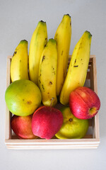 Organic fruit selection in a wooden basket