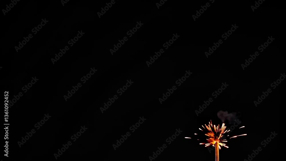 Poster dynamic video of a sparkler exploding against a dark background, captured from a low angle, emphasiz