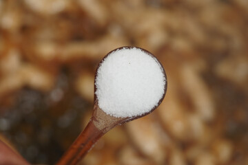 Salt being added to enhance flavors in a cooking process